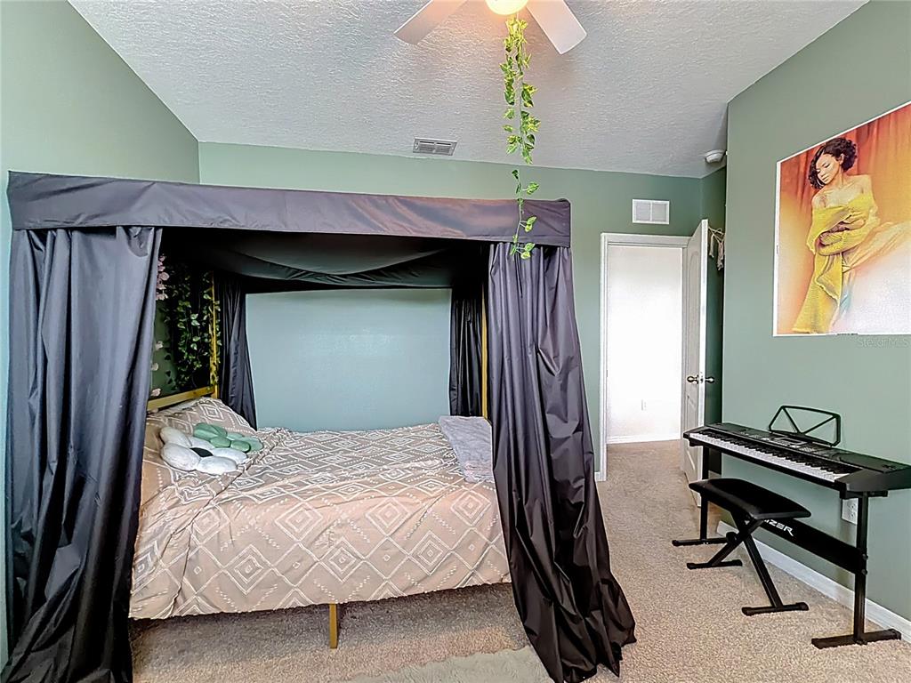 605 Honey Bell Road Winter Haven, FL 33880 - Photo 58 of 73 a bedroom with a bed and a window