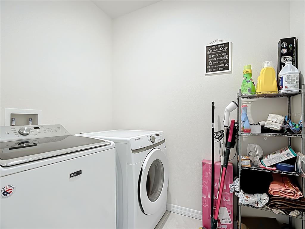 605 Honey Bell Road Winter Haven, FL 33880 - Photo 61 of 73 a utility room with dryer and washer