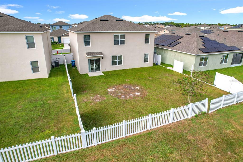 605 Honey Bell Road Winter Haven, FL 33880 - Photo 64 of 71 a view of a house with backyard and porch