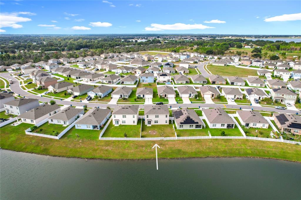605 Honey Bell Road Winter Haven, FL 33880 - Photo 70 of 71 an aerial view of residential houses with outdoor space and street view
