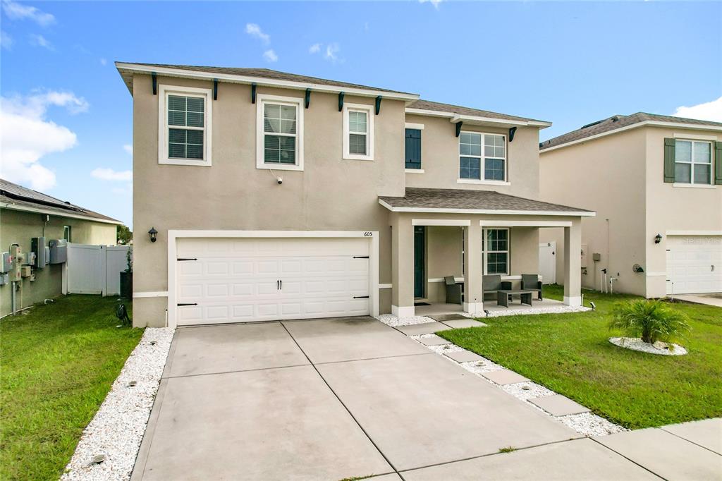605 Honey Bell Road Winter Haven, FL 33880 - Photo 8 of 71 a front view of a house with a yard