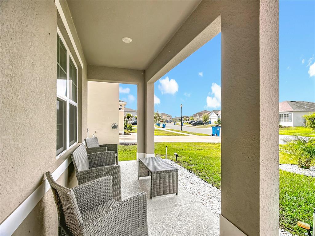 605 Honey Bell Road Winter Haven, FL 33880 - Photo 10 of 71 a living room with furniture and a large window