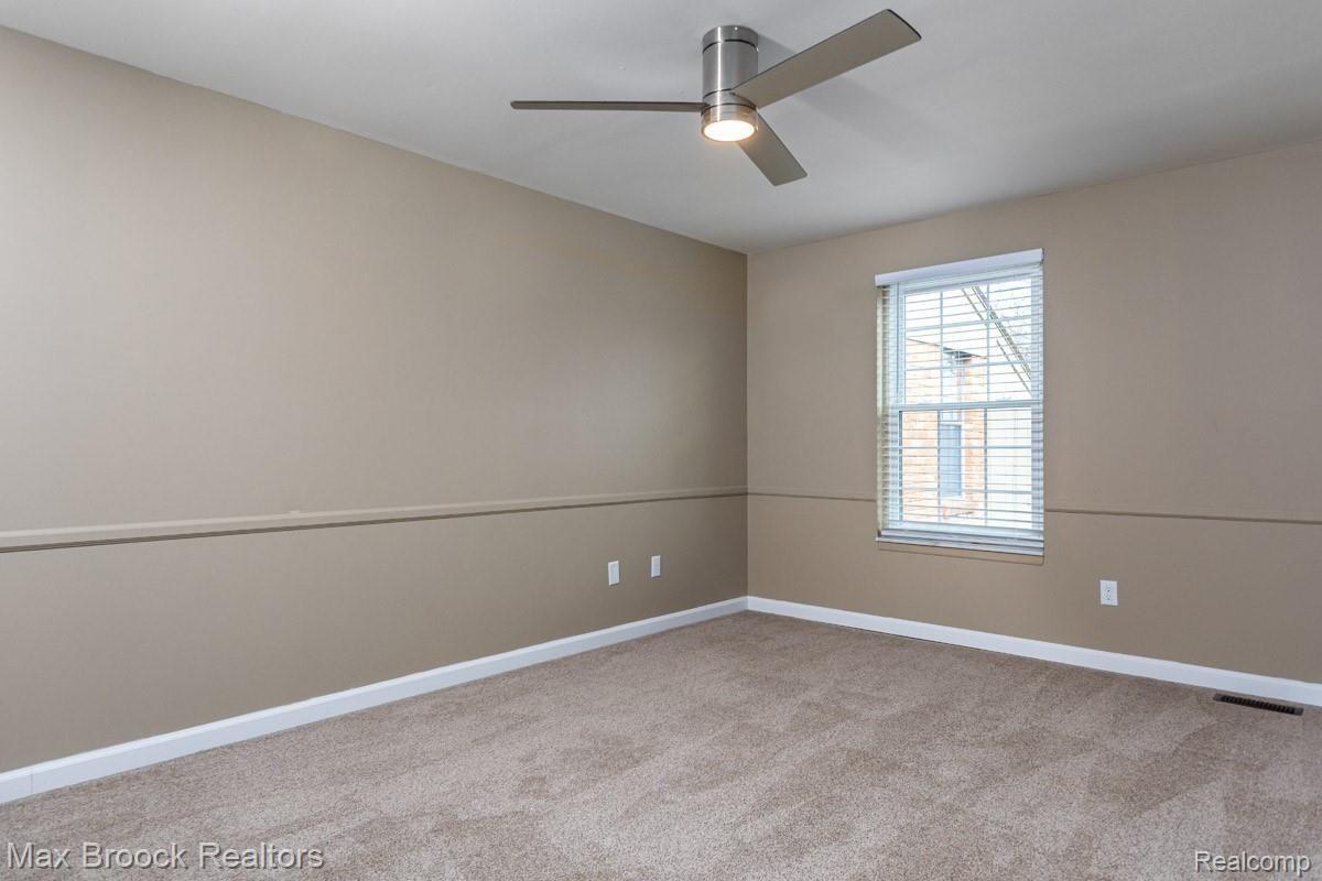 1808 Thomas Court Rochester, MI 48309 - Photo 18 of 34 4.jpg New light fixture with fan, new windows and carpet in Bedroom 3