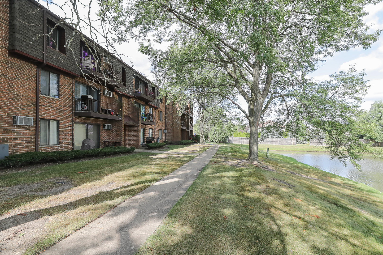 744 Briar Hill Lane, Unit 5 Addison, IL 60101 - Photo 2 of 20 a view of a building with a yard