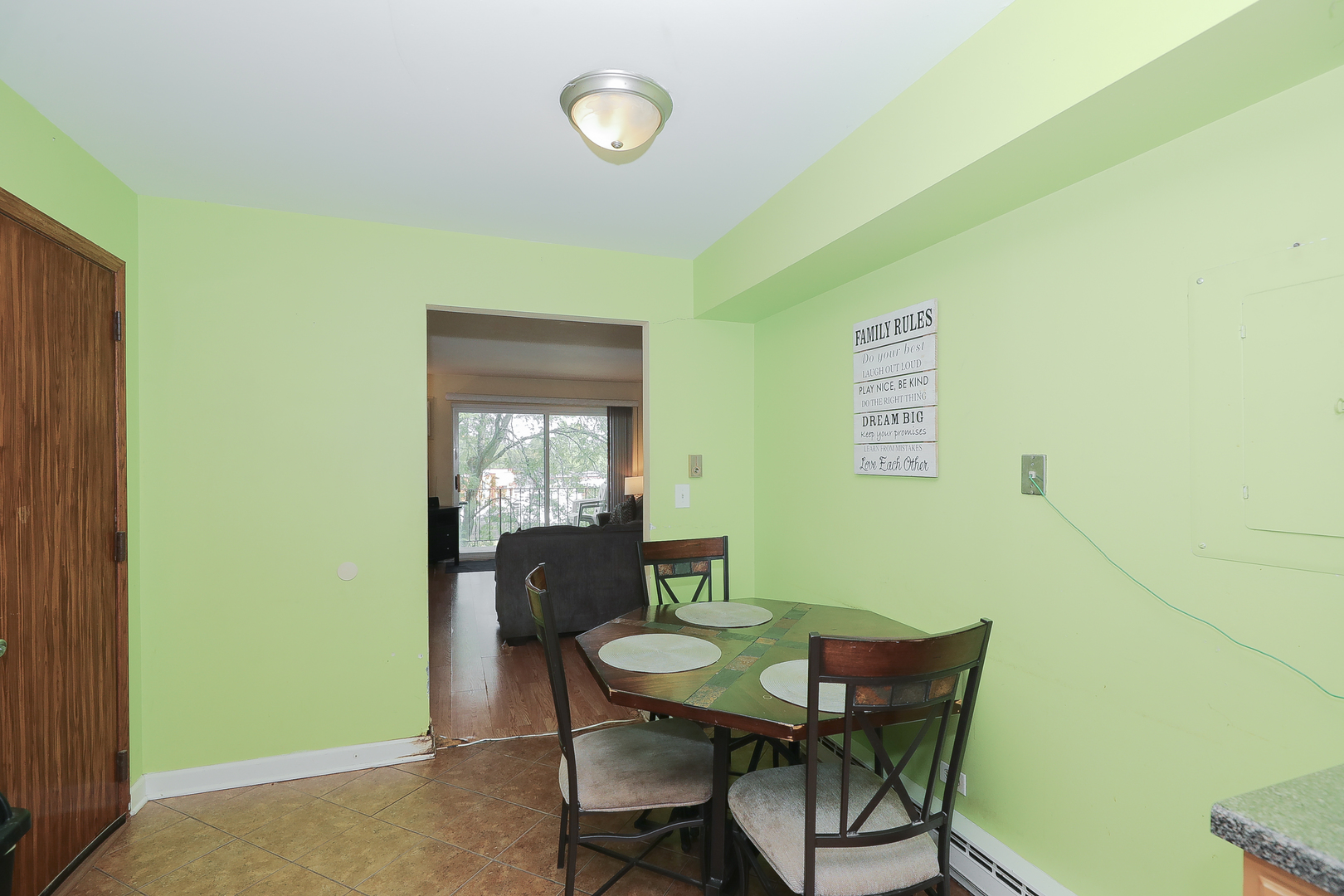 744 Briar Hill Lane, Unit 5 Addison, IL 60101 - Photo 8 of 20 a view of a dining room with furniture and a window