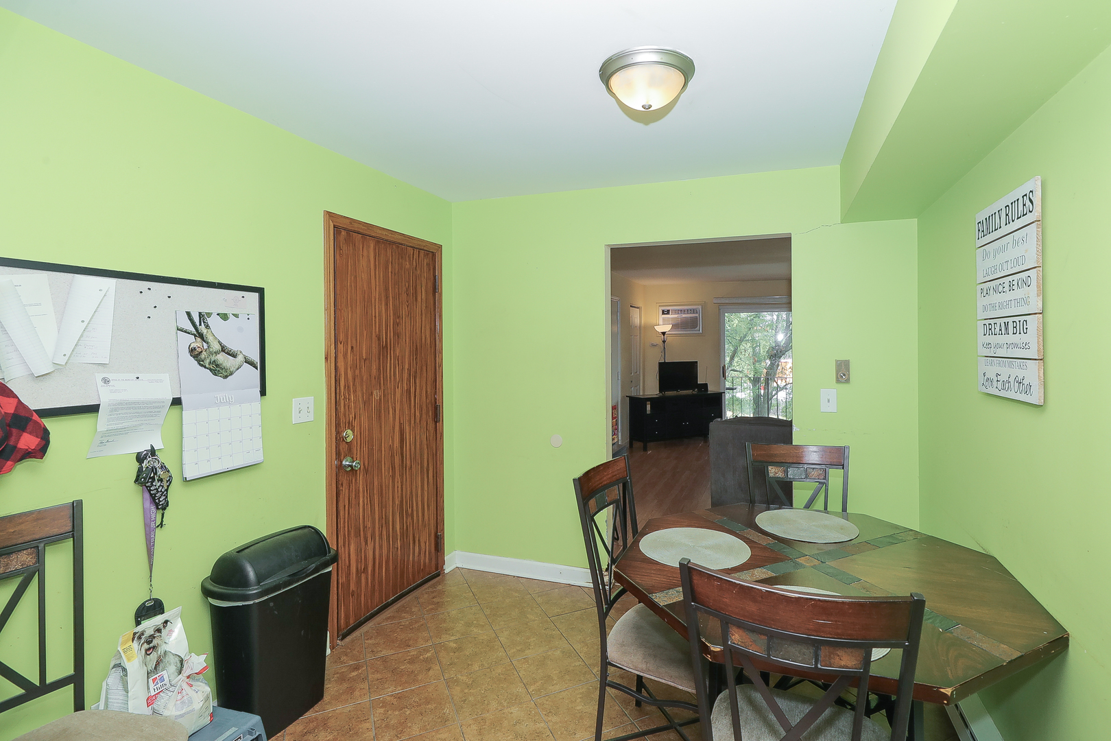 744 Briar Hill Lane, Unit 5 Addison, IL 60101 - Photo 9 of 20 a view of a dining room with furniture and a potted plant