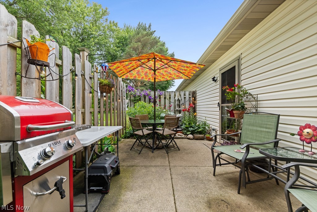 808 Ryan Road, Unit 14 Medina, OH 44256 - Photo 30 of 40 Concrete patio with a privacy fence and exterior siding