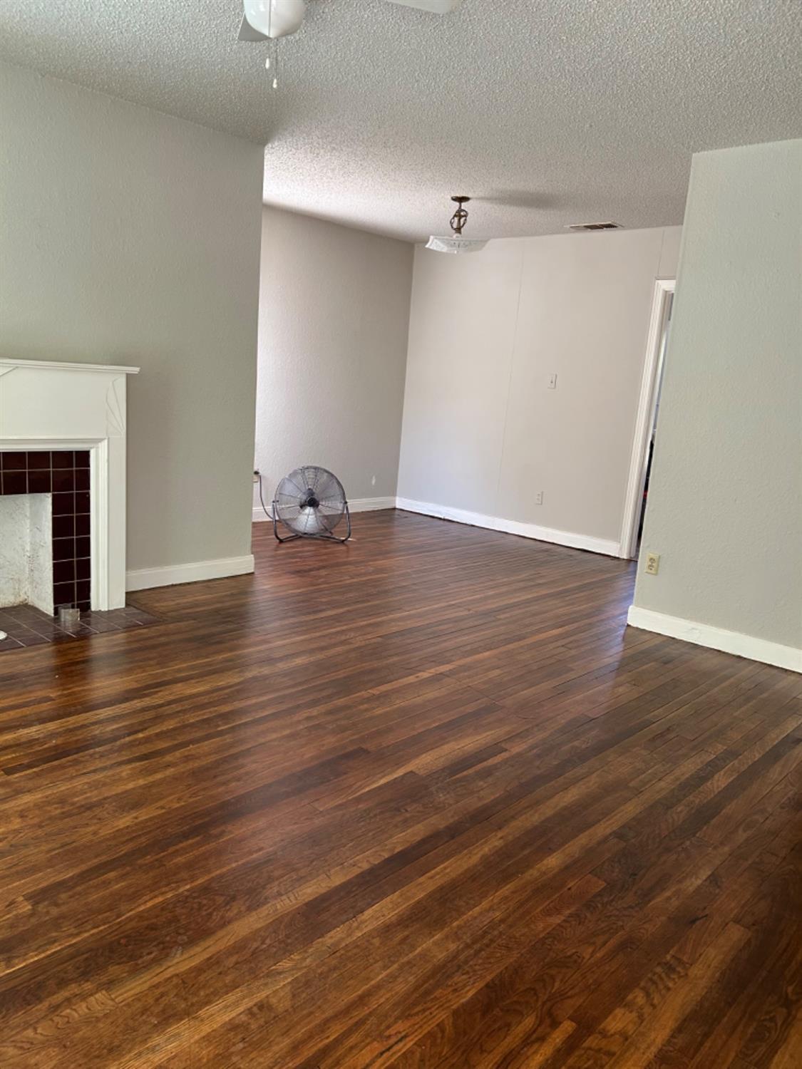 2818 27th Street Lubbock, TX 79410 - Photo 7 of 7 a view of empty room with wooden floor