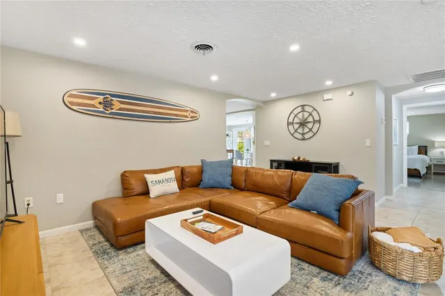 a living room with furniture and a table