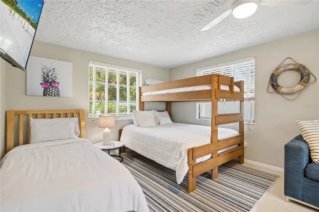 a view of a house with backyard porch and sitting area