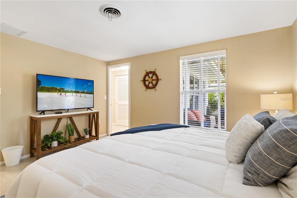 2365 Bay Street Sarasota, FL 34237 - Photo 33 of 93 a bedroom with a bed and a flat screen tv