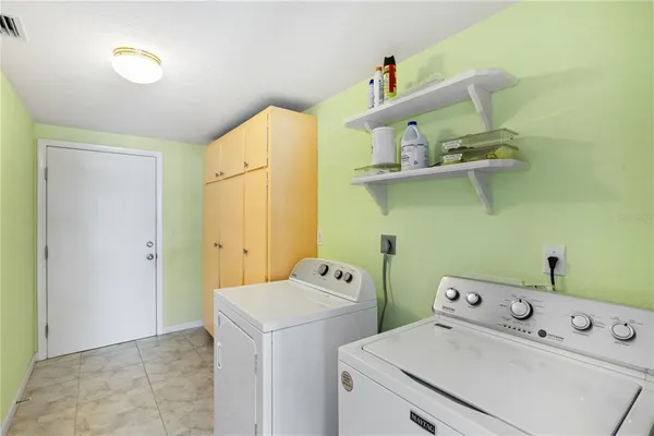 a kitchen with a stove a sink and a refrigerator