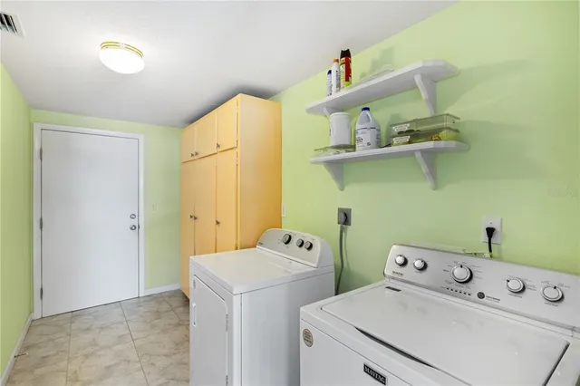 a kitchen with a stove a sink and a refrigerator