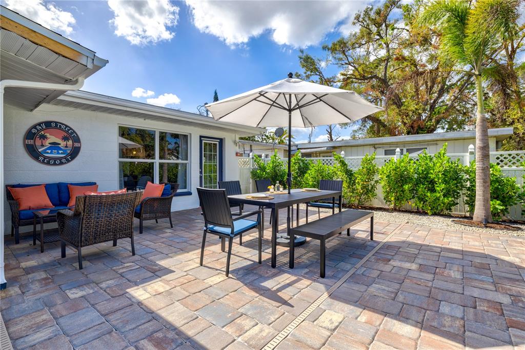 2365 Bay Street Sarasota, FL 34237 - Photo 39 of 93 a view of a dinning table and chairs in patio