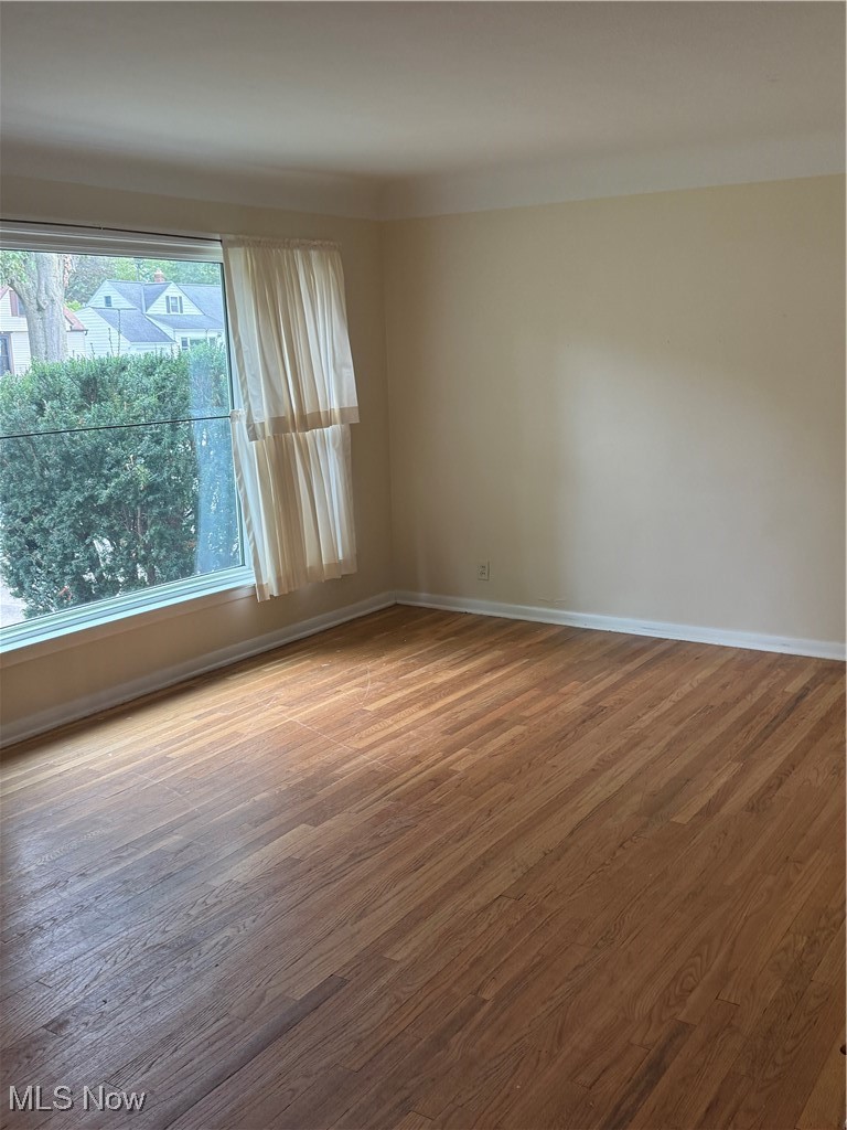 1284 Haverston Road Lyndhurst, OH 44124 - Photo 9 of 43 Unfurnished room with wood finished floors