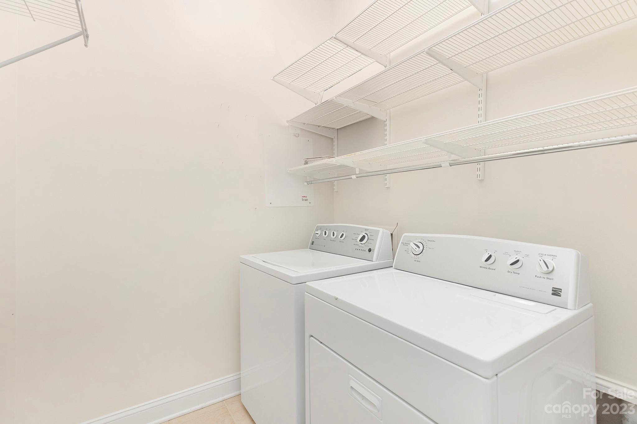5425 Closeburn Road Charlotte, NC 28210 - Photo 18 of 21 a utility room with dryer and washer