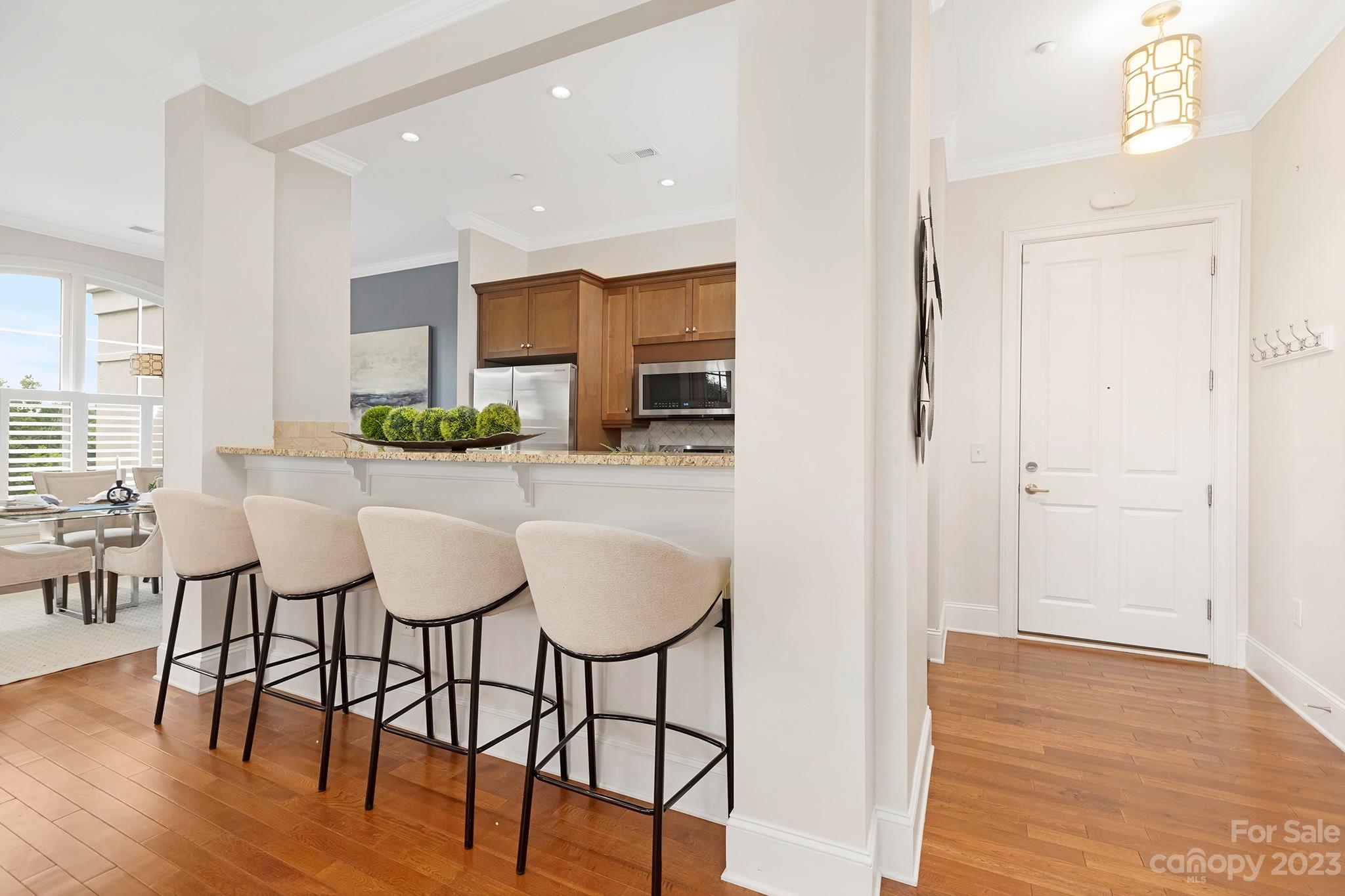 5425 Closeburn Road Charlotte, NC 28210 - Photo 5 of 21 a view of a dining room with furniture and wooden floor