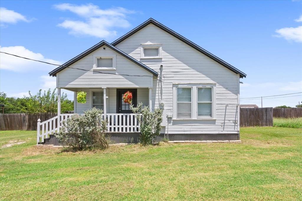 102 Brookshire Street Riesel, TX 76682 - Photo 1 of 24 a front view of a house with garden