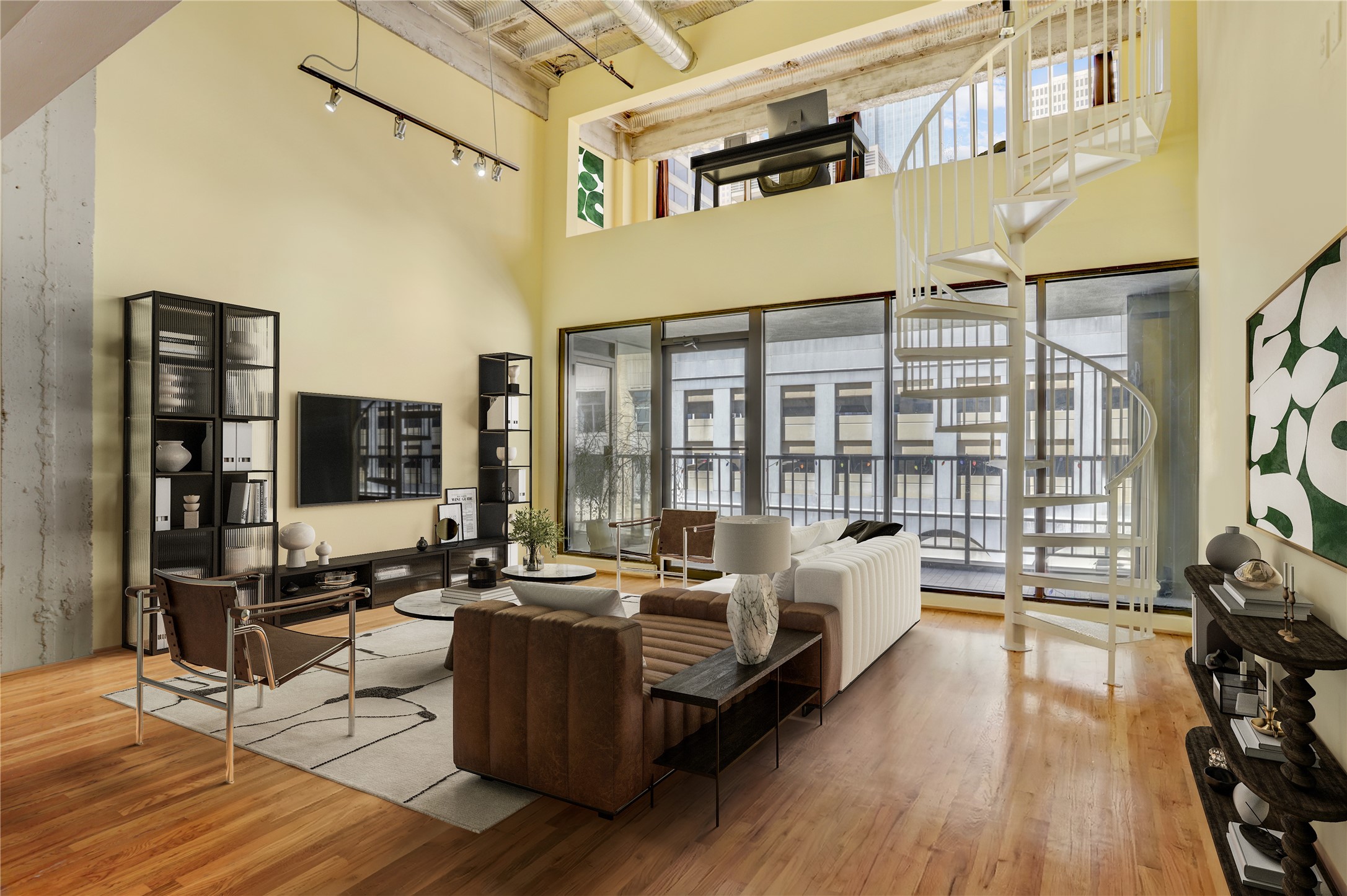 a living room with furniture and large windows