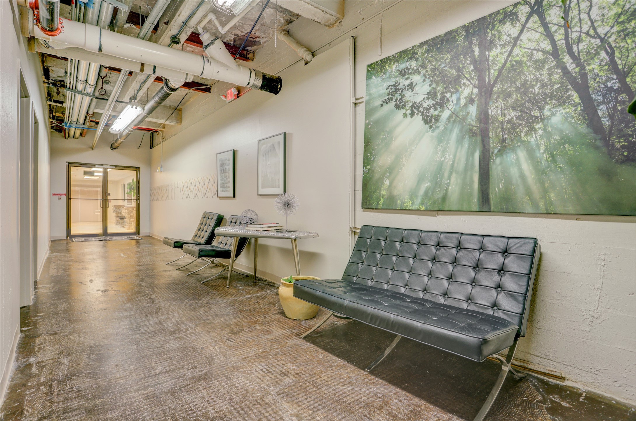 917 Main Street, Unit 1107 Houston, TX 77002 - Photo 26 of 33 a room with lots of white furniture and a chandelier
