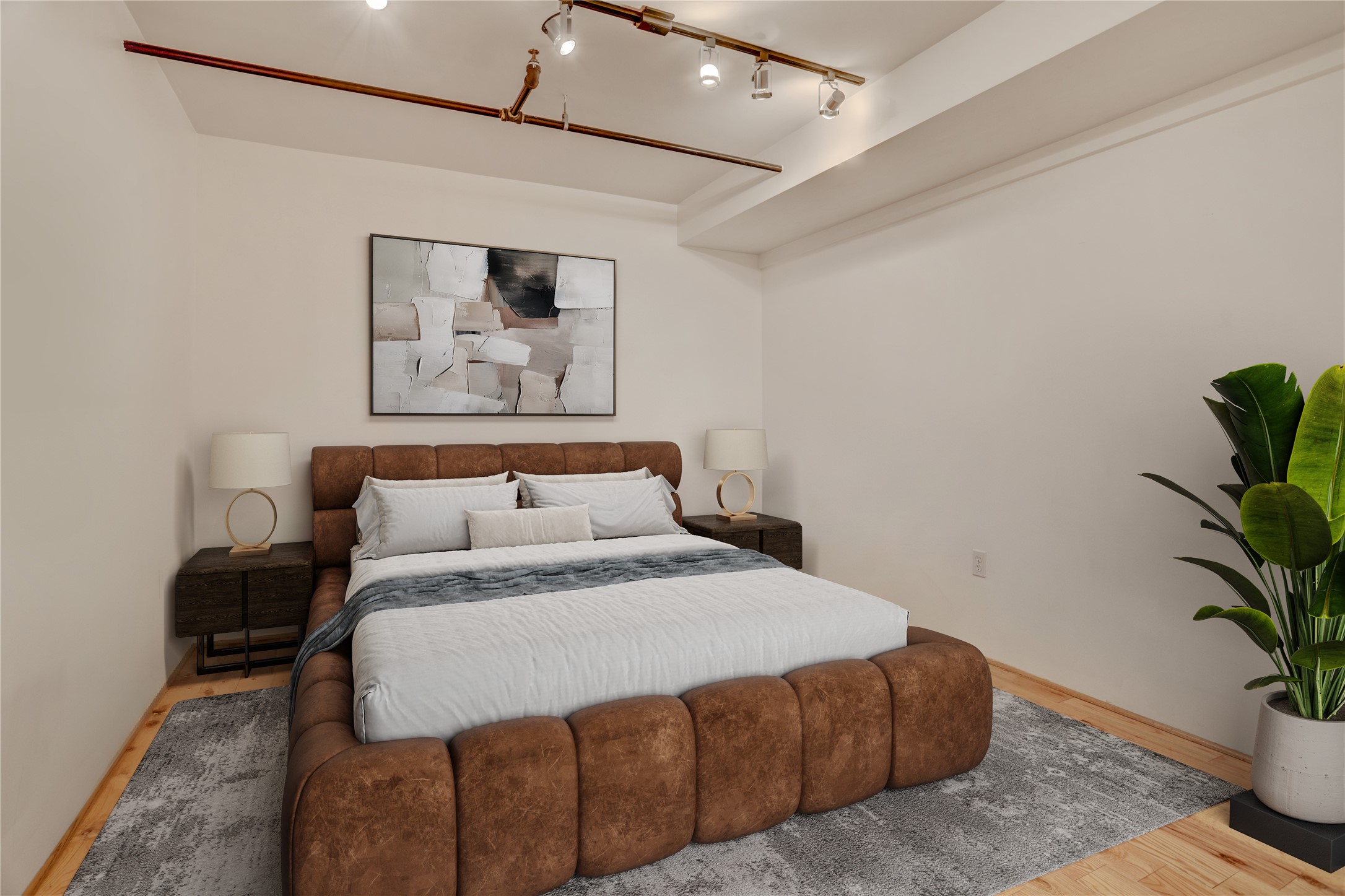 917 Main Street, Unit 1107 Houston, TX 77002 - Photo 9 of 33 a bedroom with a bed and a potted plant