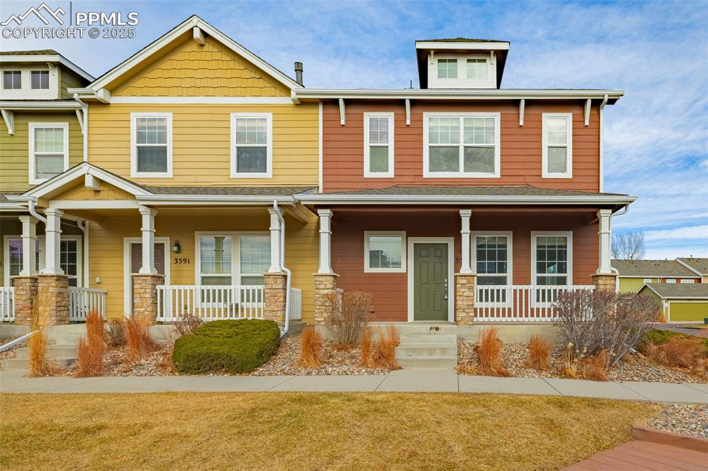 3597 Grey Owl Point Colorado Springs, CO 80916 - Photo 2 of 42 a front view of a house having yard