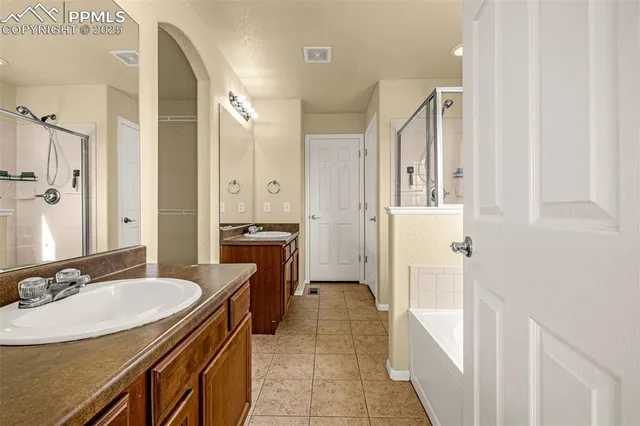 a bathroom with a sink double vanity and a mirror