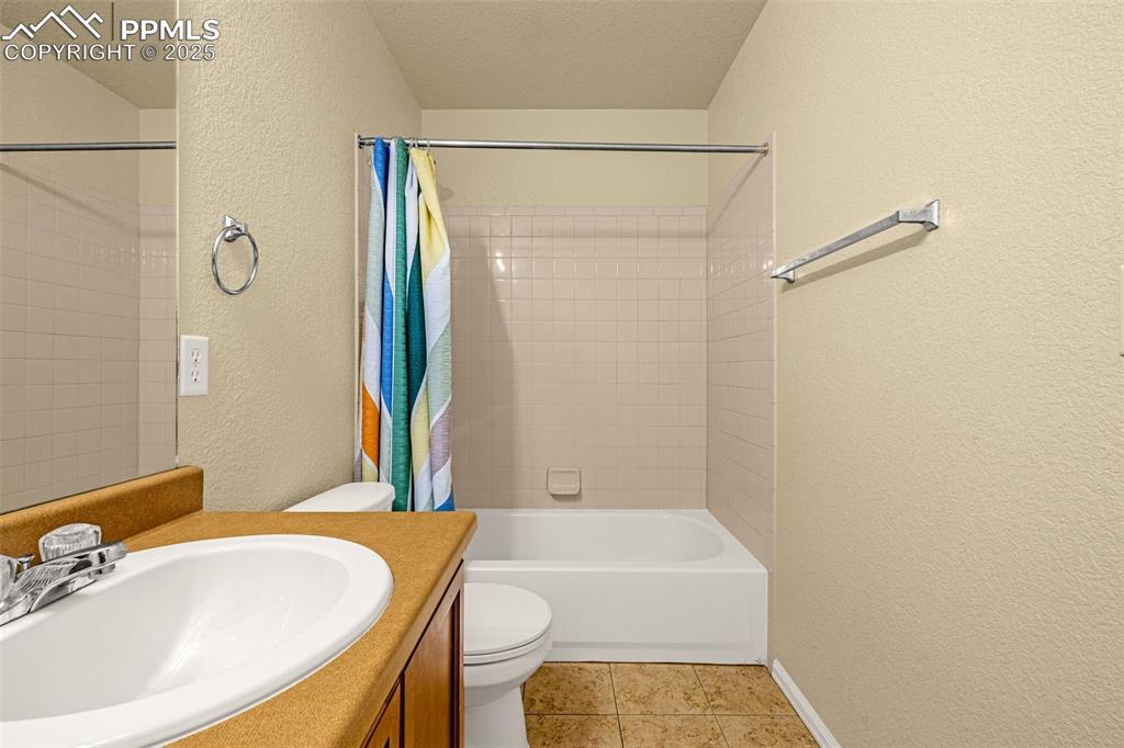 3597 Grey Owl Point Colorado Springs, CO 80916 - Photo 29 of 42 a bathroom with a sink and a bathtub