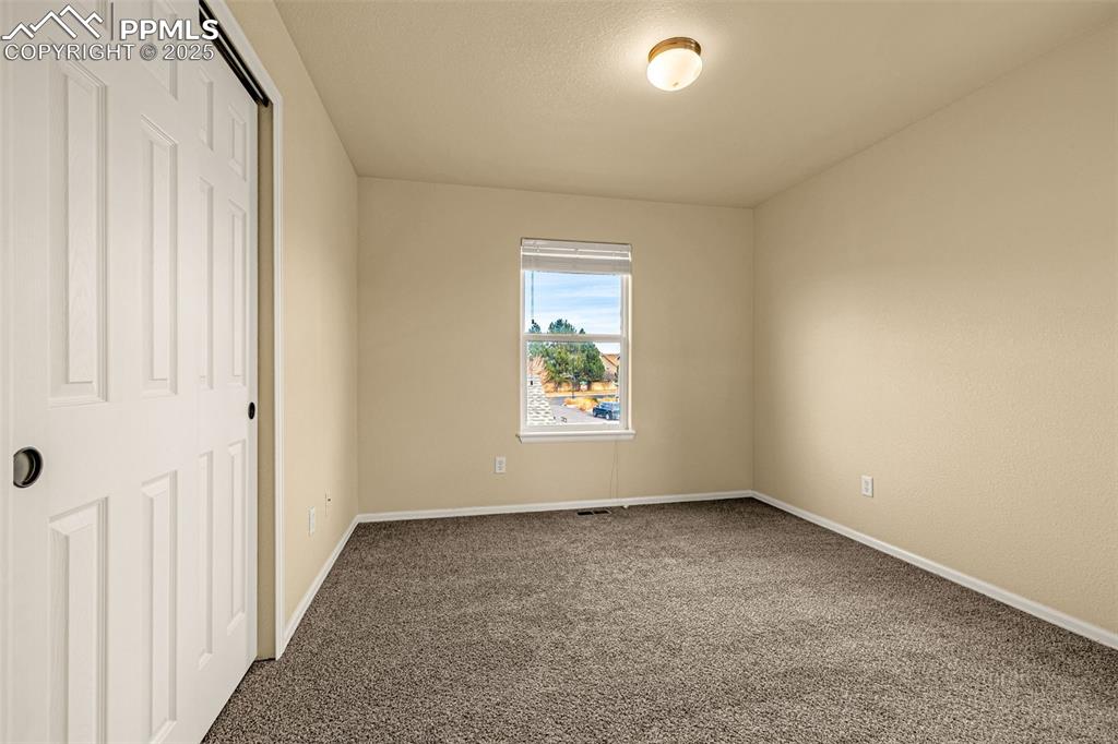 3597 Grey Owl Point Colorado Springs, CO 80916 - Photo 32 of 42 an empty room with a window
