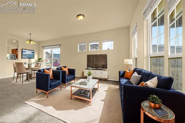 a living room with furniture and a flat screen tv