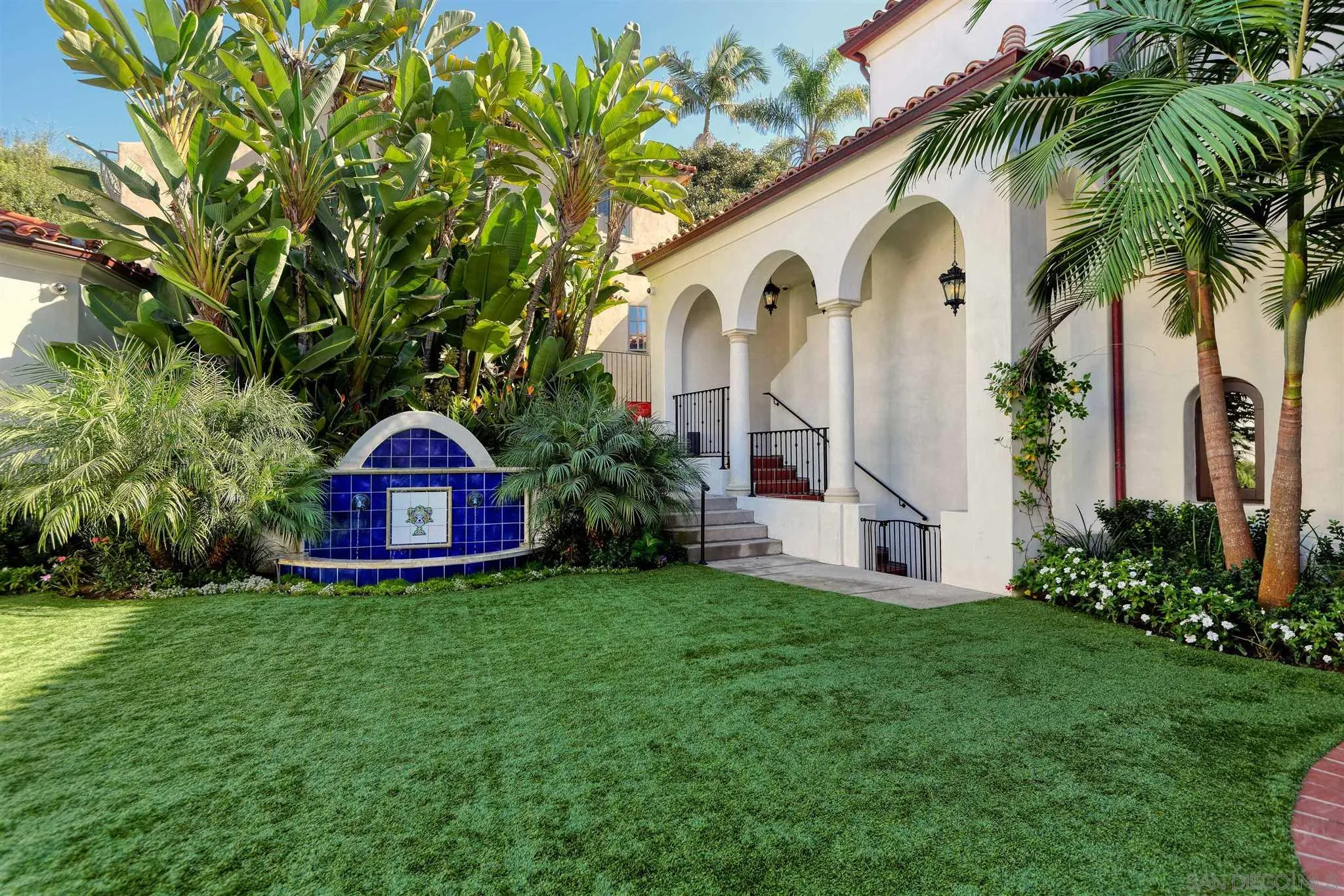 7907 Princess Street La Jolla, CA 92037 - Photo 14 of 41 a view of a house with a small yard and a palm tree