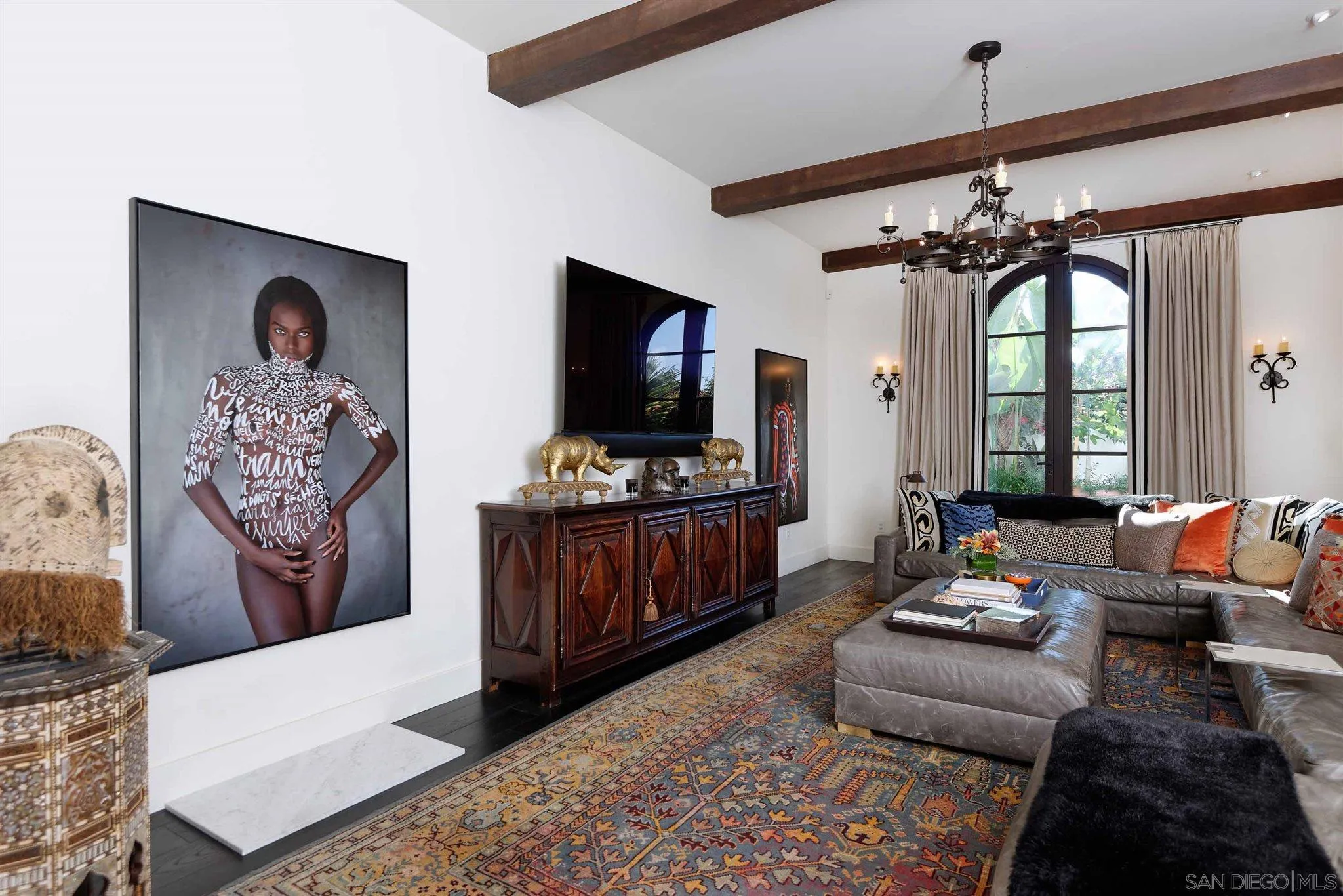 7907 Princess Street La Jolla, CA 92037 - Photo 19 of 41 a living room with furniture and a flat screen tv