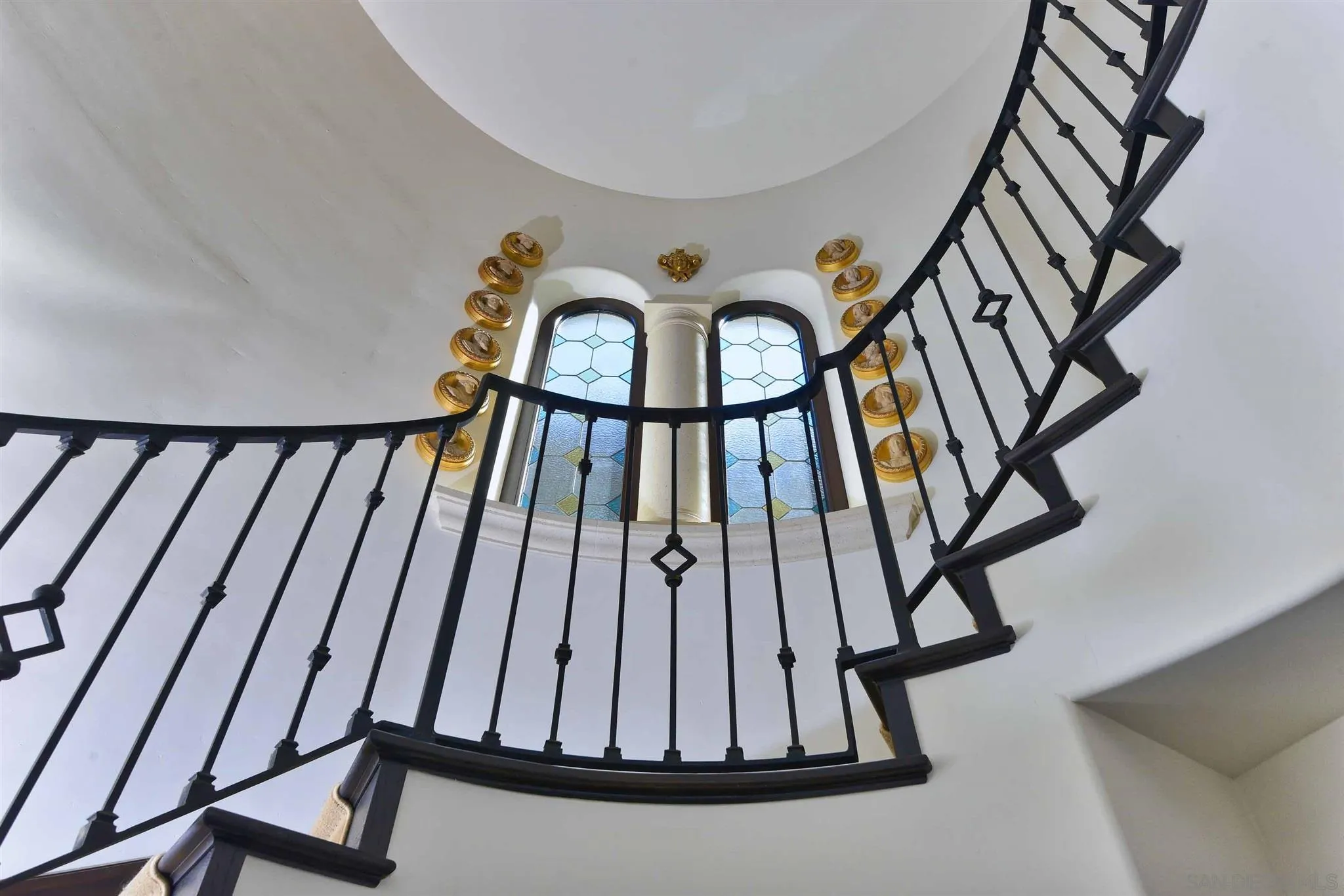 7907 Princess Street La Jolla, CA 92037 - Photo 22 of 41 a view of staircase with wooden floor