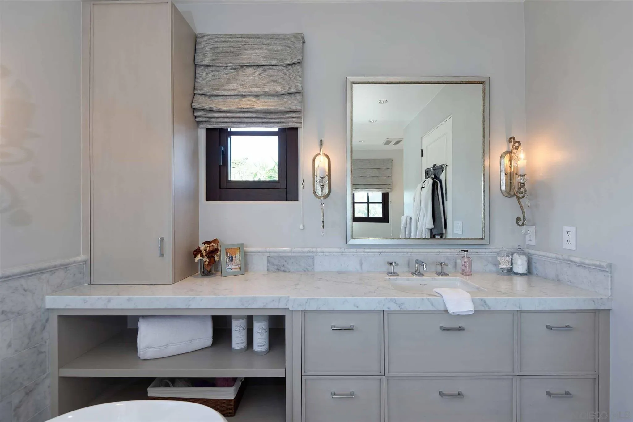 7907 Princess Street La Jolla, CA 92037 - Photo 29 of 41 a bathroom with a sink and a mirror