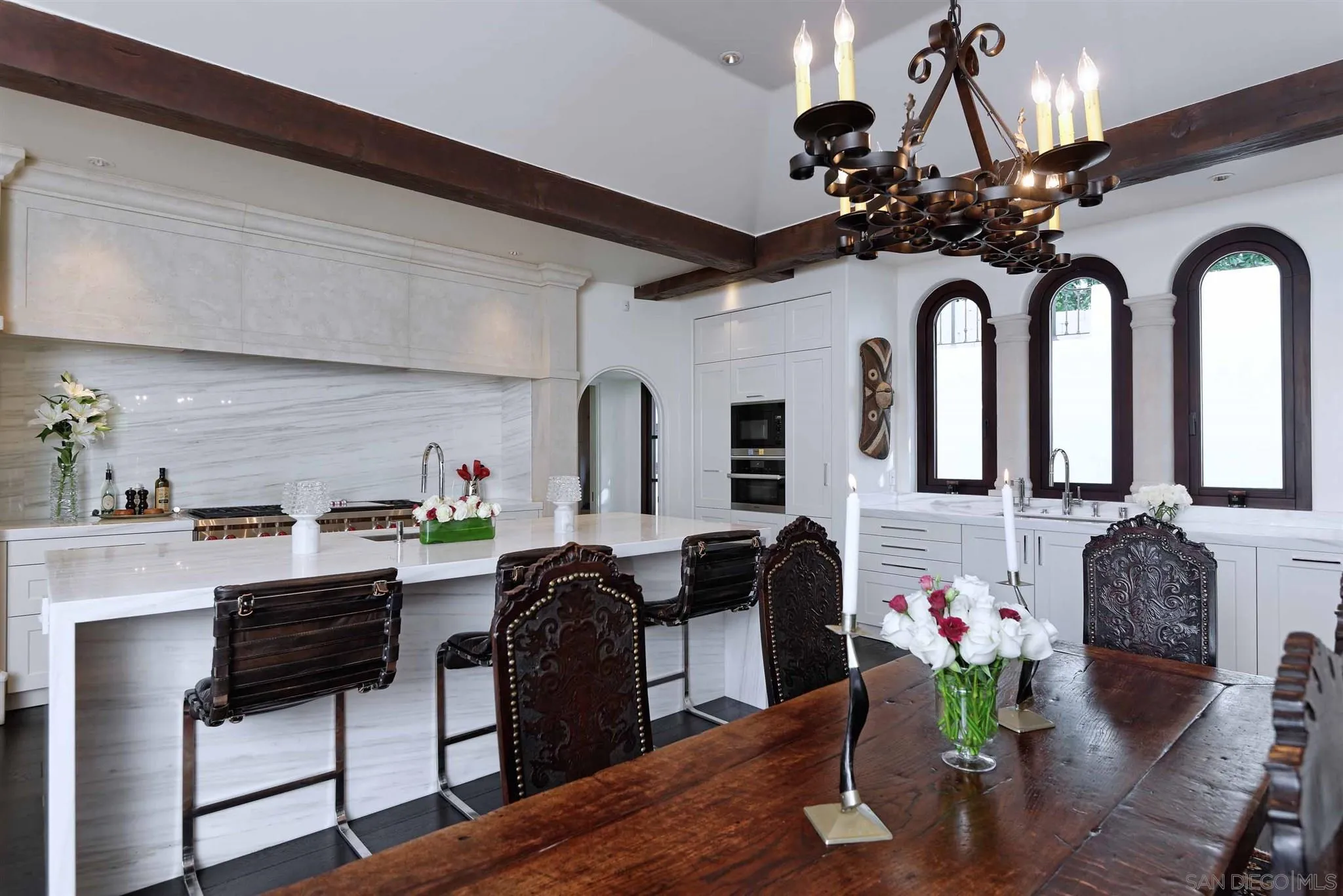 7907 Princess Street La Jolla, CA 92037 - Photo 8 of 41 a view of a dining room with furniture and chandelier