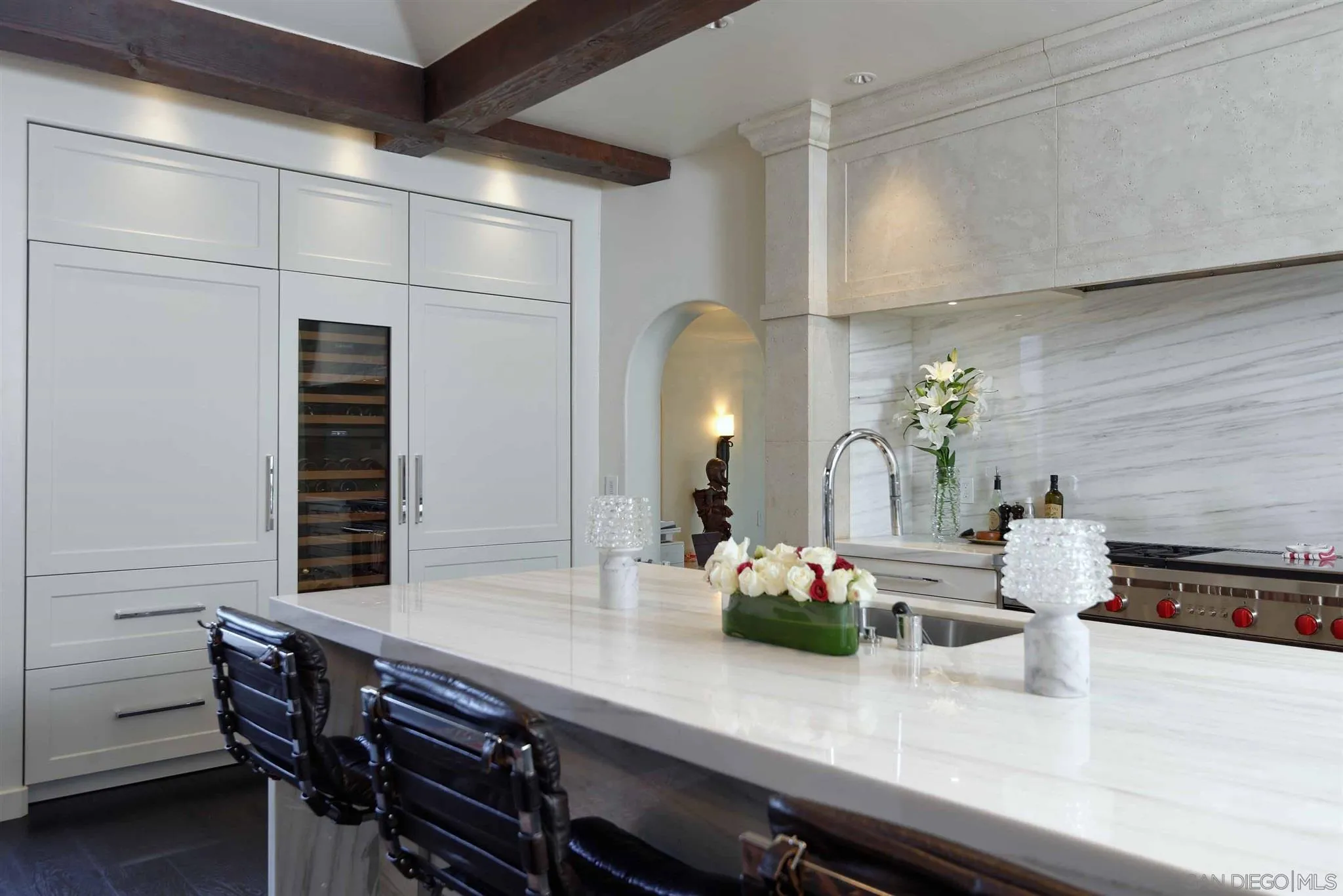 7907 Princess Street La Jolla, CA 92037 - Photo 9 of 41 a kitchen with a table and chairs in it