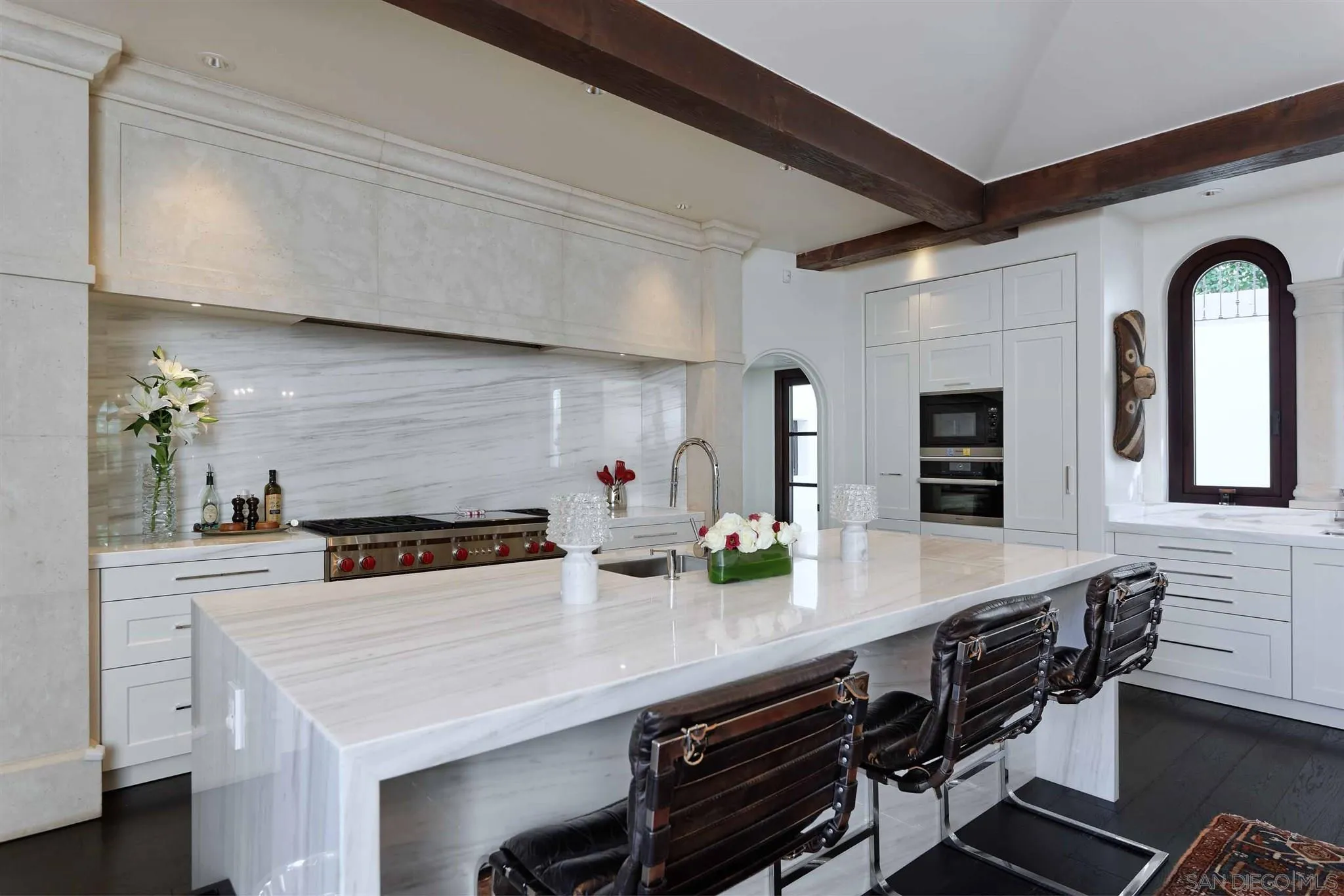 7907 Princess Street La Jolla, CA 92037 - Photo 10 of 41 a kitchen with stainless steel appliances a sink and stove