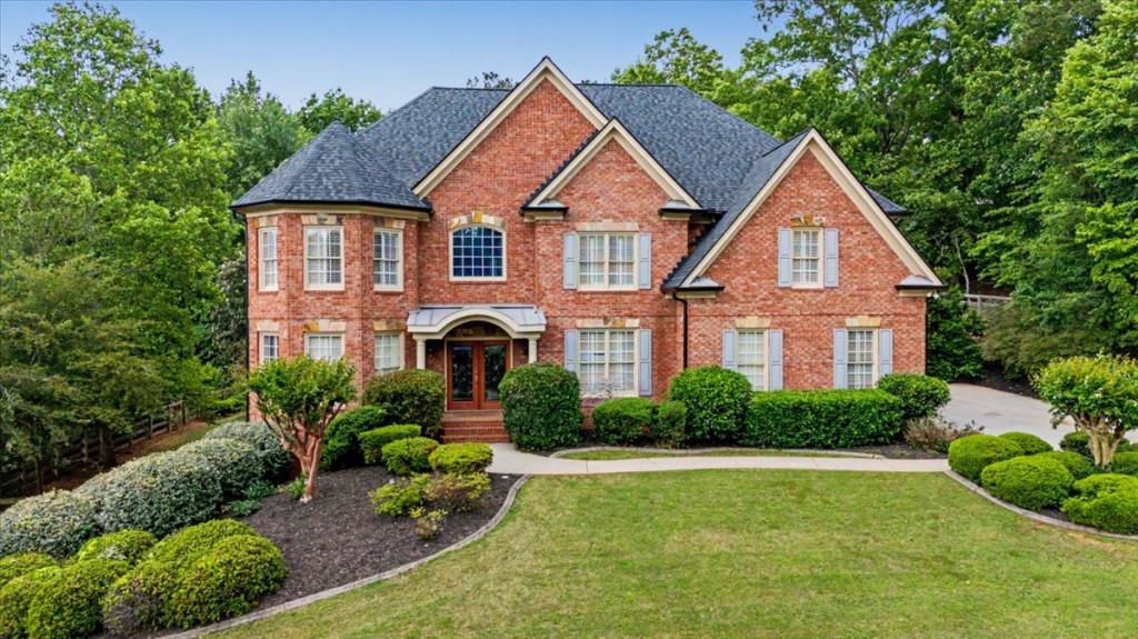 122 Ridge View Drive Ball Ground, GA 30107 - Photo 2 of 84 a front view of a house with a yard