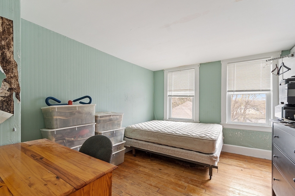 17 Prospect Street Maynard, MA 01754 - Photo 14 of 30 a bedroom with a bed and a window