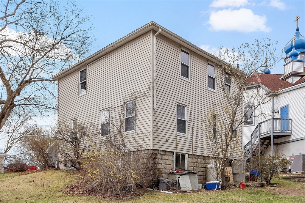 17 Prospect Street Maynard, MA 01754 - Photo 25 of 30 a view of a white building among the street