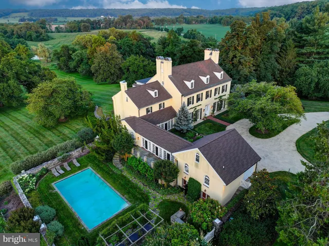 an aerial view of a house with a garden