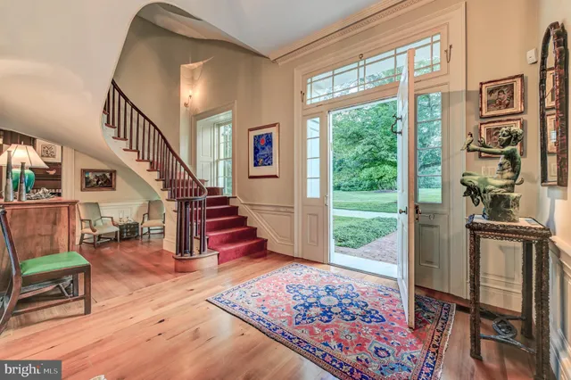 a view of a house with a yard and swimming pool