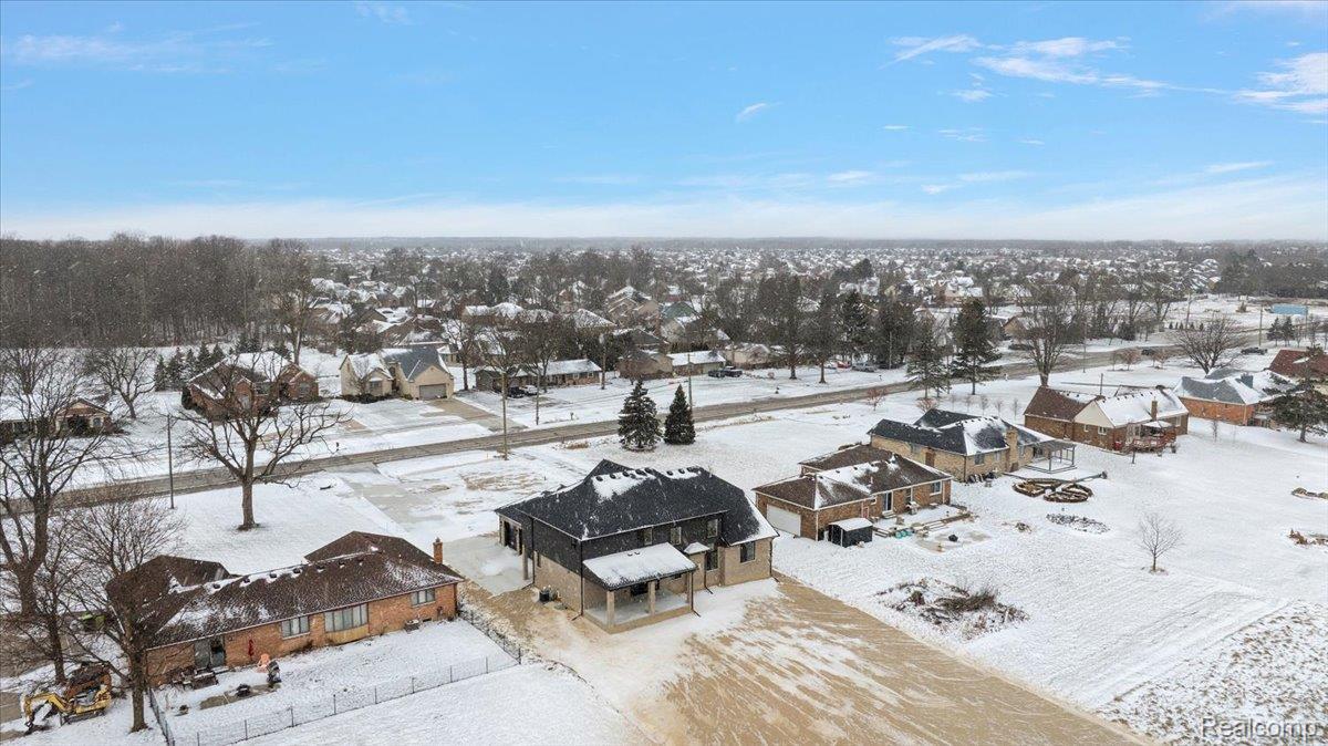 53650 Romeo Plank Road Macomb, MI 48042 - Photo 52 of 64 Snowy aerial view with a residential view