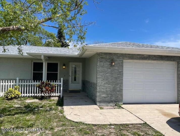 753 Tupelo Drive Melbourne, FL 32935 - Photo 1 of 12 a view of a house with a porch