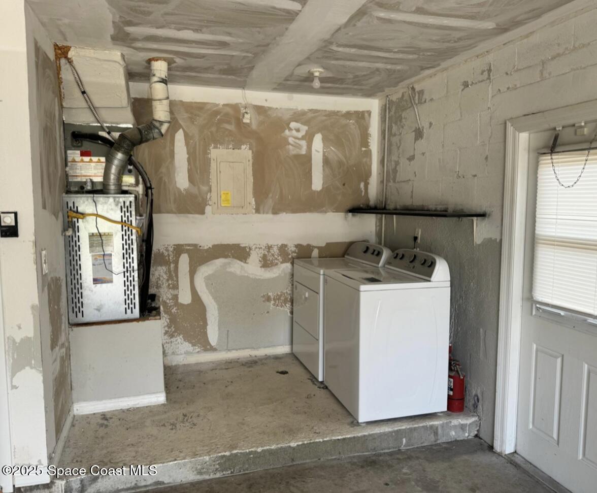 753 Tupelo Drive Melbourne, FL 32935 - Photo 11 of 12 a utility room with cabinets