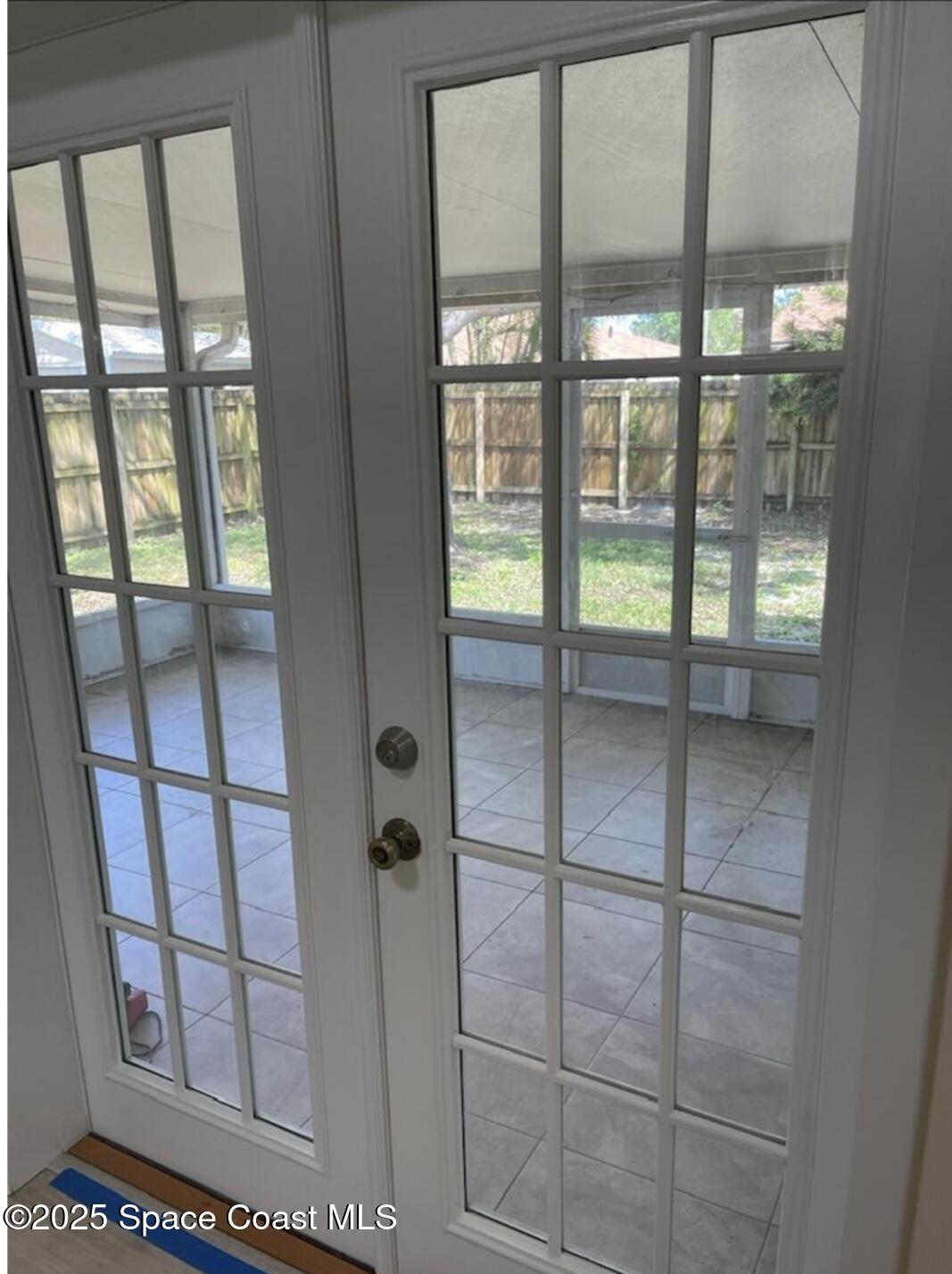 753 Tupelo Drive Melbourne, FL 32935 - Photo 6 of 12 a bathroom with sliding glass door and shower