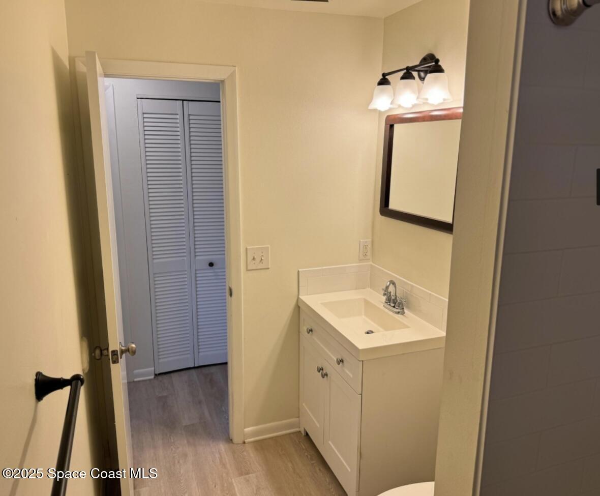 753 Tupelo Drive Melbourne, FL 32935 - Photo 7 of 12 a bathroom with a sink and a mirror