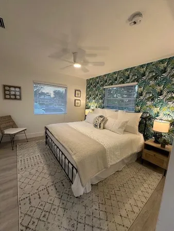 a bedroom with a bed and a couch