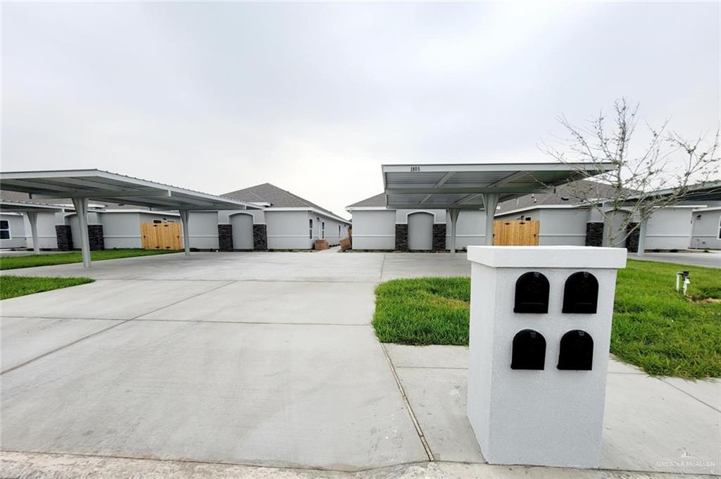 1805 Davenport Street, Unit 1 Weslaco, TX 78596 - Photo 1 of 20 a house view with a garden space