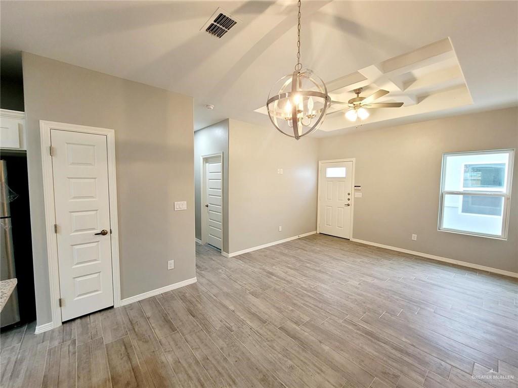 1805 Davenport Street, Unit 1 Weslaco, TX 78596 - Photo 10 of 20 an empty room with wooden floor and window